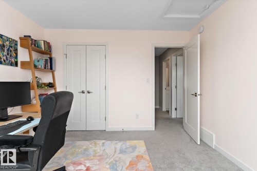 Plush gray carpeting throughout, featuring light-colored walls and white trim - 3241 Kulay Way Sw, Edmonton, AB - Indoor Photo Showing Office