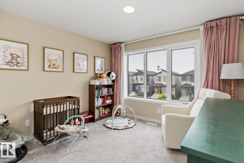 Recessed lighting, light neutral wall color, large multi-pane window, wall-to-wall carpeting - 3241 Kulay Way Sw, Edmonton, AB - Indoor