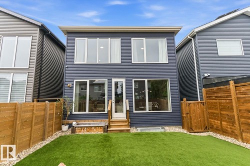 Two-story exterior with horizontal siding and multiple large windows - 3241 Kulay Way Sw, Edmonton, AB - Outdoor With Exterior