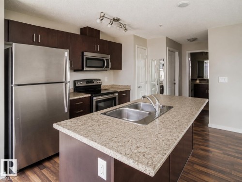 #325 5515 7 Av Sw, Edmonton, AB - Indoor Photo Showing Kitchen With Stainless Steel Kitchen With Double Sink With Upgraded Kitchen
