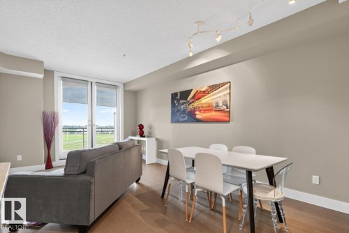 #510 11080 Ellerslie Rd Sw, Edmonton, AB - Indoor Photo Showing Living Room With Fireplace
