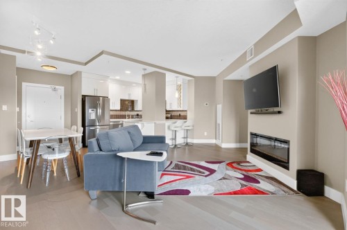 #510 11080 Ellerslie Rd Sw, Edmonton, AB - Indoor Photo Showing Living Room With Fireplace