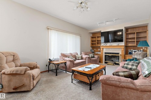 120 Northlake Lane, Wetaskiwin, AB - Indoor Photo Showing Living Room With Fireplace