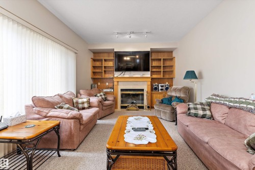 120 Northlake Lane, Wetaskiwin, AB - Indoor Photo Showing Living Room With Fireplace