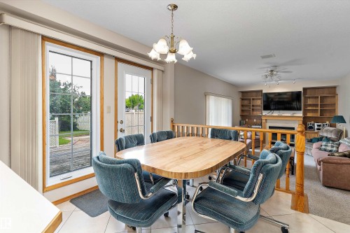 120 Northlake Lane, Wetaskiwin, AB - Indoor Photo Showing Dining Room With Fireplace