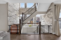 Two-story stone accent wall with multiple windows - 