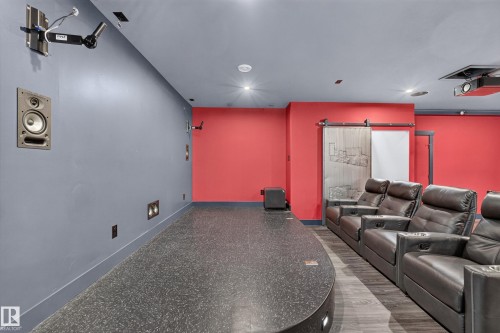 Recessed lighting, built-in wall speakers, terrazzo-style flooring, and wood-finish flooring - 1399 Graydon Hill Way Sw, Edmonton, AB - Indoor Photo Showing Other Room