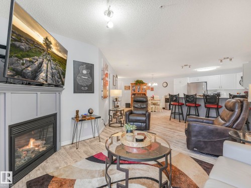 #208 16035 132 St Nw, Edmonton, AB - Indoor Photo Showing Living Room With Fireplace