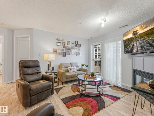 #208 16035 132 St Nw, Edmonton, AB - Indoor Photo Showing Living Room With Fireplace