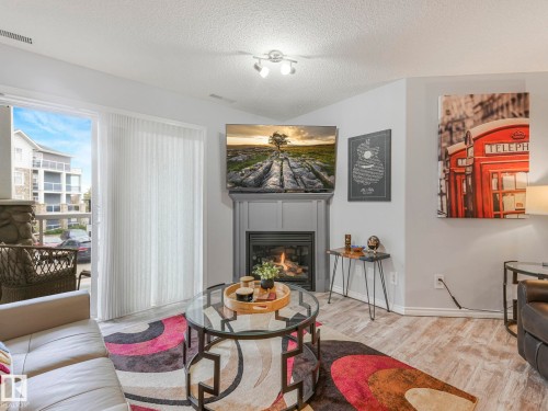 #208 16035 132 St Nw, Edmonton, AB - Indoor Photo Showing Living Room With Fireplace