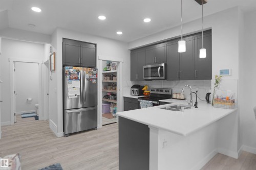 2551 12 Avenue Nw, Edmonton, AB - Indoor Photo Showing Kitchen With Double Sink With Upgraded Kitchen