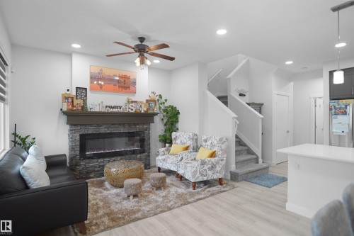 2551 12 Avenue Nw, Edmonton, AB - Indoor Photo Showing Living Room With Fireplace