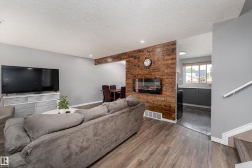 9012 Meadowlark Road Nw, Edmonton, AB - Indoor Photo Showing Living Room With Fireplace