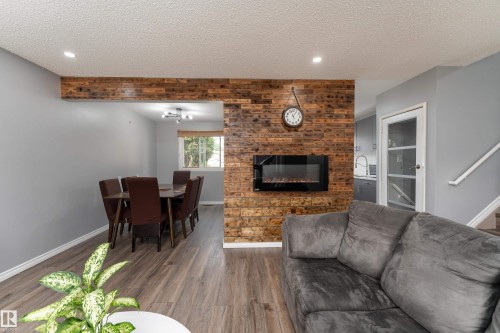 9012 Meadowlark Road Nw, Edmonton, AB - Indoor Photo Showing Living Room With Fireplace