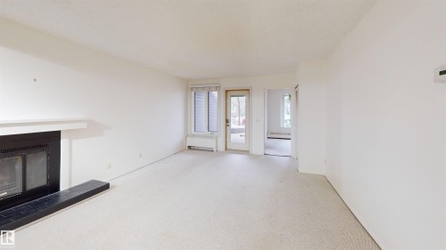 #109 11115 80 Av Nw, Edmonton, AB - Indoor With Fireplace