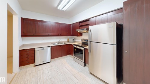 #109 11115 80 Av Nw, Edmonton, AB - Indoor Photo Showing Kitchen With Stainless Steel Kitchen With Double Sink