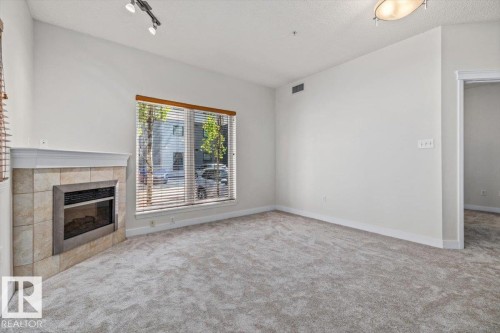 #118 10333 112 St Nw, Edmonton, AB - Indoor With Fireplace