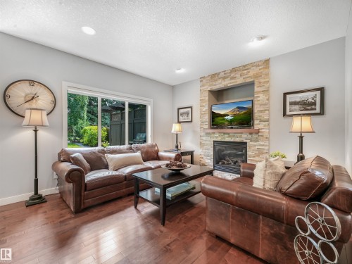 4609 60 Street, Beaumont, AB - Indoor Photo Showing Living Room With Fireplace