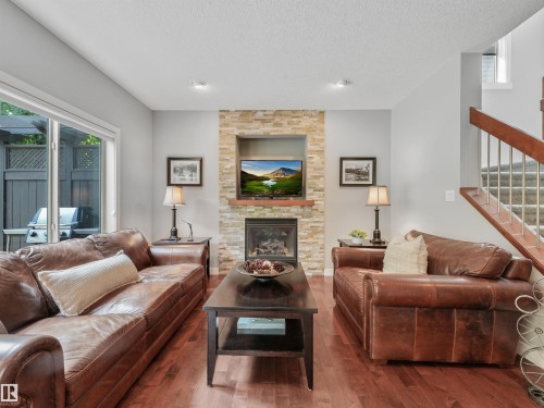 4609 60 Street, Beaumont, AB - Indoor Photo Showing Living Room With Fireplace