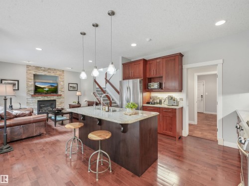 4609 60 Street, Beaumont, AB - Indoor Photo Showing Kitchen With Fireplace With Upgraded Kitchen