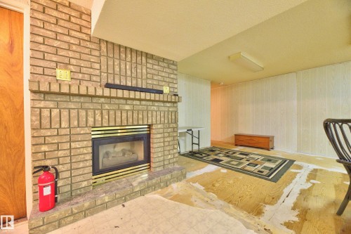455 Huffman Crescent Nw, Edmonton, AB - Indoor Photo Showing Living Room With Fireplace