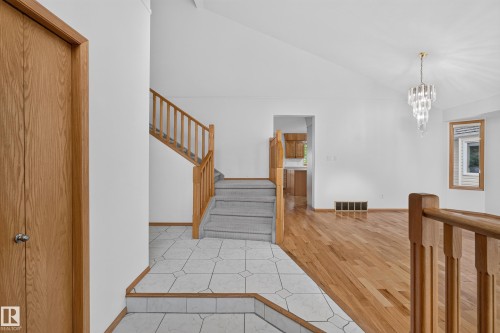 Vaulted ceilings, hardwood flooring, and a crystal chandelier - 306 Twin Brooks Drive Nw, Edmonton, AB 