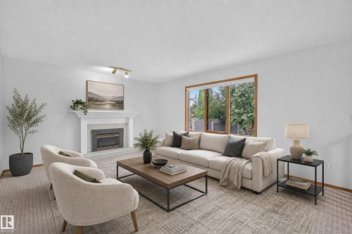 White walls, wood-framed window, fireplace with white mantel, track lighting, and wall-to-wall carpeting - 306 Twin Brooks Drive Nw, Edmonton, AB 