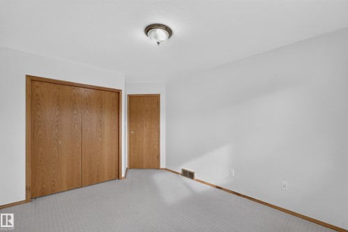 Light-toned wall-to-wall carpeting and white painted walls - 306 Twin Brooks Drive Nw, Edmonton, AB 