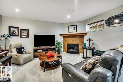 #19 50 Oakridge Dr S, St. Albert, AB - Indoor Photo Showing Other Room With Fireplace