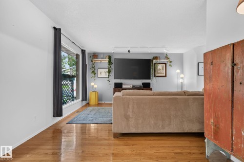 Hardwood flooring, painted interior walls, and track lighting - 12 Latimer Place, St. Albert, AB - Indoor