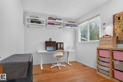 Hardwood-finish flooring, white walls, and a large window with blinds - 12 Latimer Place, St. Albert, AB - Indoor Photo Showing Office