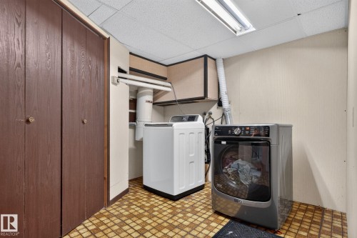 Laundry room featuring washer and dryer as well as  the utility room off to the side. - 12 Latimer Place, St. Albert, AB - Indoor Photo Showing Laundry Room