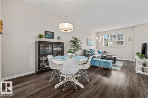 #88 320 Secord Blvd Nw, Edmonton, AB - Indoor Photo Showing Dining Room With Fireplace