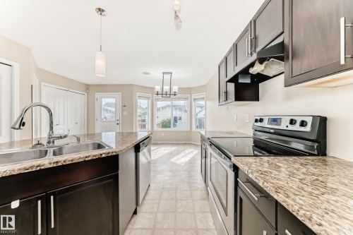 7706 Schmid Crescent Nw, Edmonton, AB - Indoor Photo Showing Kitchen With Double Sink With Upgraded Kitchen