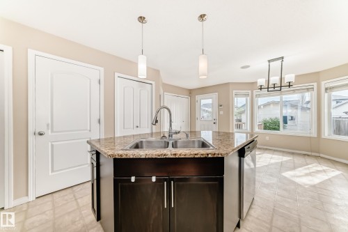 7706 Schmid Crescent Nw, Edmonton, AB - Indoor Photo Showing Kitchen With Double Sink