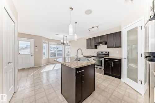 7706 Schmid Crescent Nw, Edmonton, AB - Indoor Photo Showing Kitchen With Double Sink With Upgraded Kitchen