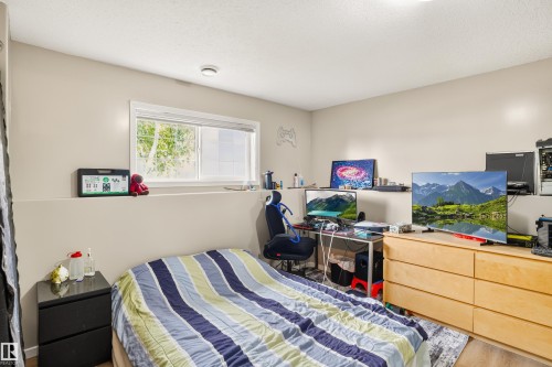 Recessed lighting, wood-finish flooring, and a window with white trim - #9 6506 47 St, Cold Lake, AB - Indoor Photo Showing Bedroom
