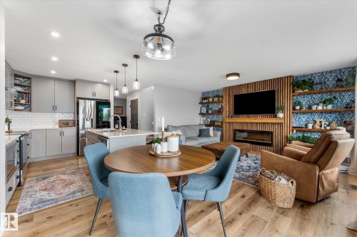 2 Caledon Crescent, Spruce Grove, AB - Indoor Photo Showing Dining Room With Fireplace