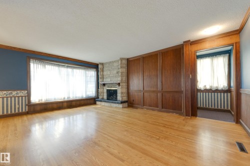 4716 109 Avenue Nw, Edmonton, AB - Indoor Photo Showing Living Room With Fireplace