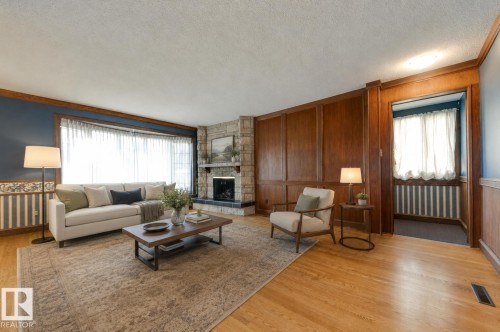 4716 109 Avenue Nw, Edmonton, AB - Indoor Photo Showing Living Room With Fireplace