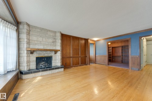 4716 109 Avenue Nw, Edmonton, AB - Indoor Photo Showing Living Room With Fireplace