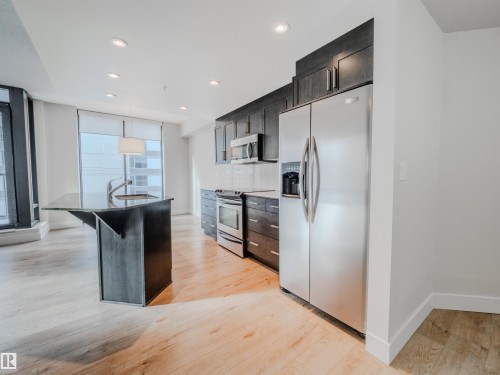 #304 11933 Jasper Av Nw, Edmonton, AB - Indoor Photo Showing Kitchen With Upgraded Kitchen