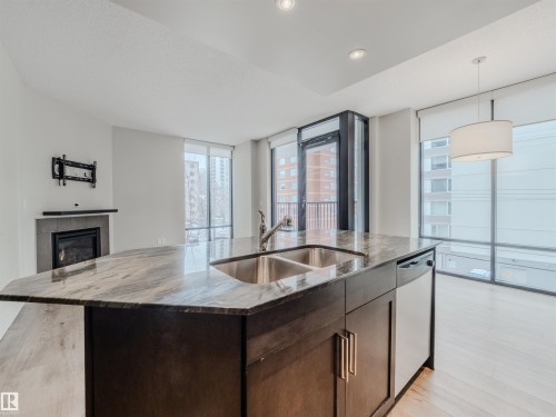 #304 11933 Jasper Av Nw, Edmonton, AB - Indoor Photo Showing Kitchen With Double Sink With Upgraded Kitchen