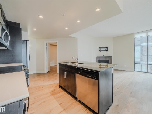 #304 11933 Jasper Av Nw, Edmonton, AB - Indoor Photo Showing Kitchen With Double Sink