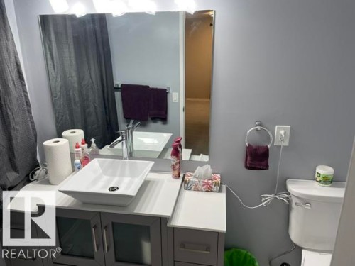 Vanity with shaker-style cabinetry, rectangular vessel sink, and chrome faucet - 27 Gatewood Avenue, St. Albert, AB - Indoor Photo Showing Bathroom