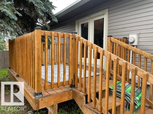 Wood deck with wood railing and steps, featuring a double glass door entry - 27 Gatewood Avenue, St. Albert, AB - Outdoor With Deck Patio Veranda With Exterior