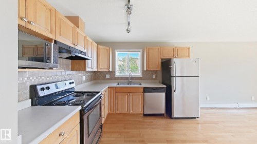 #213 5005 165 Av Nw Nw, Edmonton, AB - Indoor Photo Showing Kitchen With Double Sink