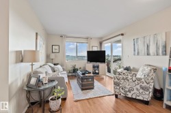 Wood-finish flooring throughout, large window with blinds, and sliding glass door leading to an outdoor space - 