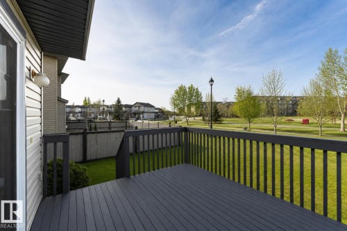 Outdoor deck with dark gray composite decking and matching railings - 192 Keyport Circle, Leduc, AB - Outdoor With Deck Patio Veranda