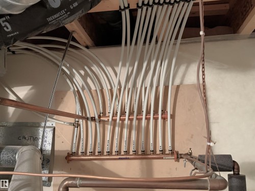 PEX tubing manifold system featuring copper piping and insulated ductwork - 192 Keyport Circle, Leduc, AB - Indoor